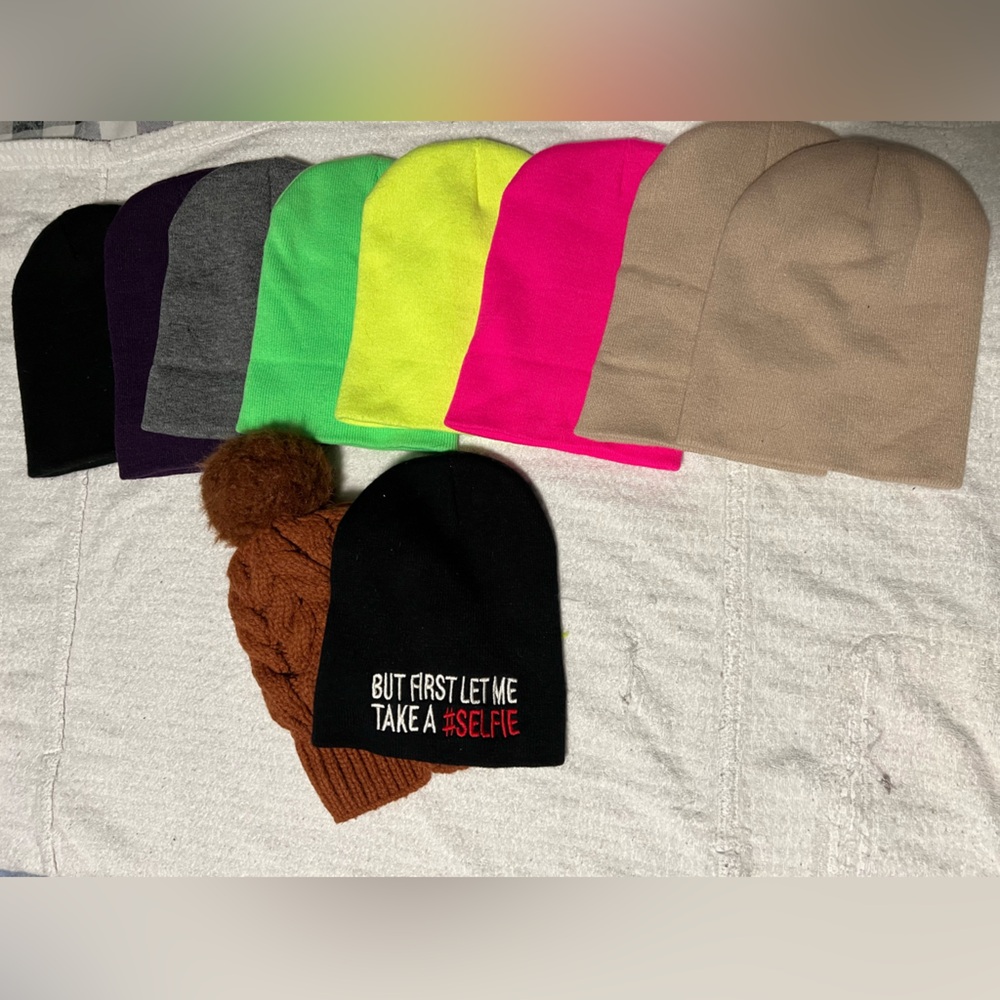 Lot of mostly 8 new solid beanies, 1 with text and 1 crochet. Crochet is worn.